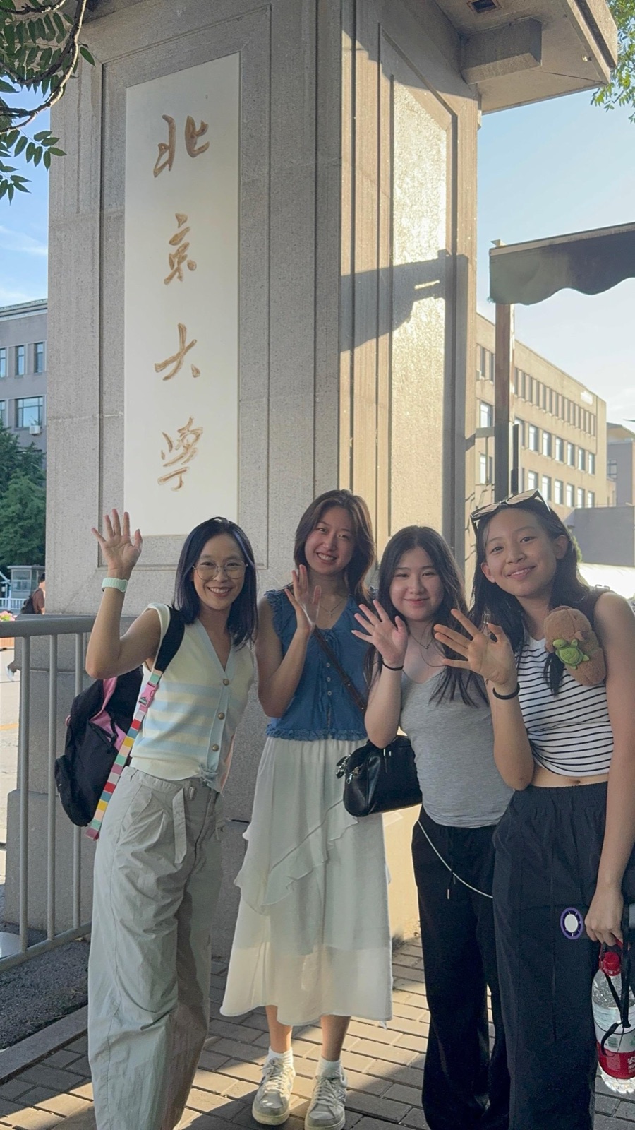 Lynda with MMC students at Peking University gate, Beijing 2025