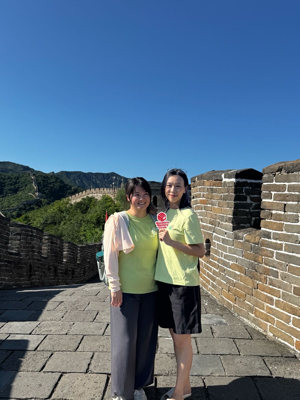 Lynda and Serena at the Great Wall of China in MMC t-shirts